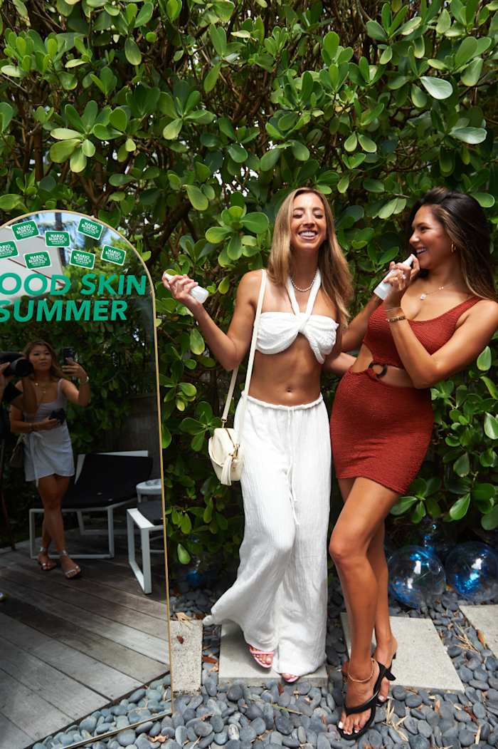 Katie Austin and Christen Harper using Mario Basescu at Miami Swim Week 2022.